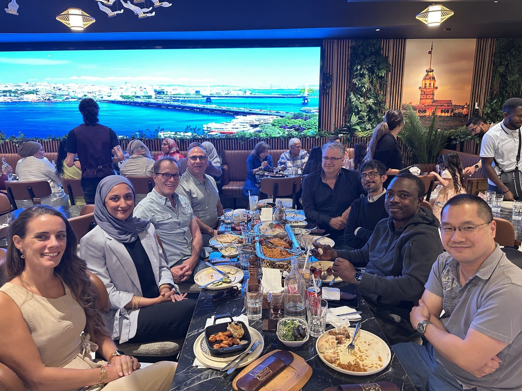 Guests seated along a long communal table at a Karmaflow AI agents dinner in Ottawa.